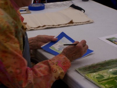 Helen showing us her "framed" work - before she begins tinting her print with watercolor.